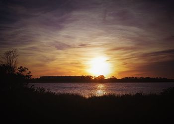 Scenic view of sunset over river