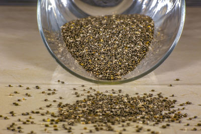 High angle view of coffee beans in glass on table