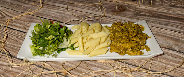 High angle view of vegetables in plate on table