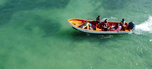 High angle view of people in boat on sea