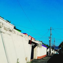 Built structures against clear blue sky