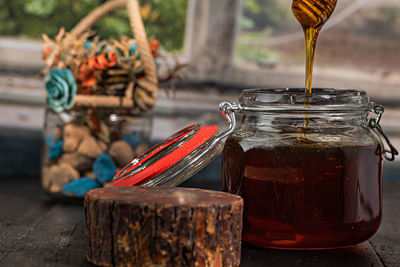 Close-up of glass jar on table