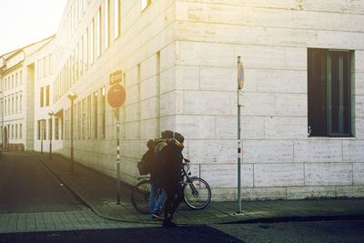 People walking on road in city