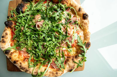 High angle view of pizza served in plate