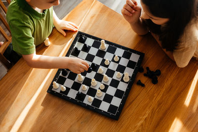 High angle view of baby playing on table at home