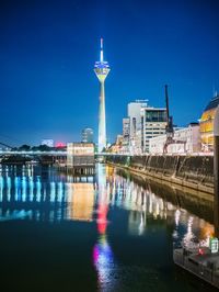 View of illuminated buildings at waterfront