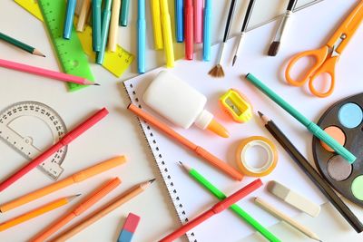 Directly above shot of various school supplies on table