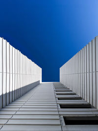 Low angle view of building against clear blue sky