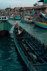 A fisherman who has just returned from the sea and wants to dock his boat