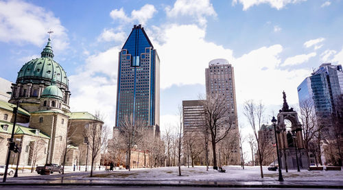 Panoramic view of buildings in city against sky