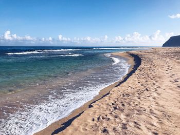 Scenic view of beach against sky