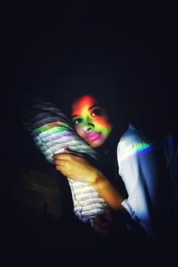 Portrait of boy in darkroom