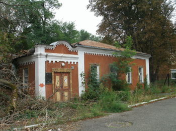 Exterior of old building by trees