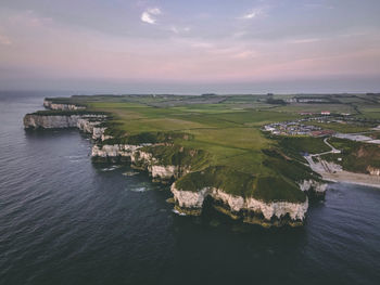 High angle view of sea against sky during sunset