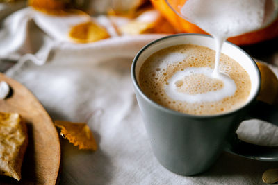 Close-up of coffee cup on table