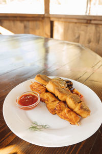 High angle view of serving food in plate on table