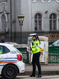 Full length of woman standing in city