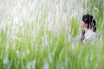 Woman relaxing in field