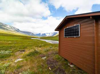 Small wooden hut in the middle of the sarek national park, sweden. 