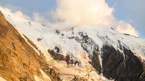 Panoramic view of snowcapped mountains against sky