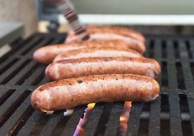 Close-up of sausages on barbecue grill