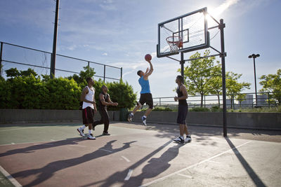 People playing basketball court