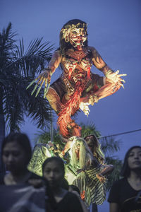 Low angle view of statue against sky