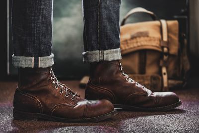 Low section of man wearing leather shoes