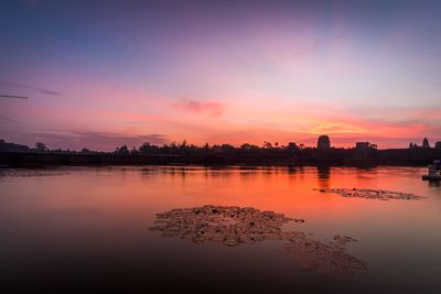 Scenic view of lake against sky during sunset