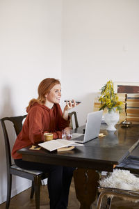 Smiling woman using cell phone