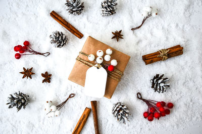 Zero waste christmas presents with decorations on white snow background. copy space. eco friendly 