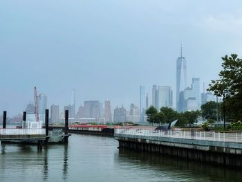 Bridge over river with buildings in background