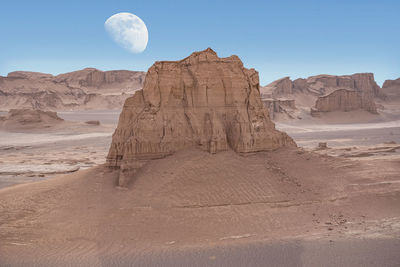 View of rock formation in desert against sky