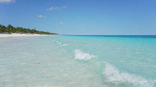 Scenic view of sea against clear blue sky