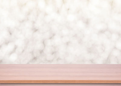 Close-up of table against wall