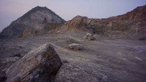 Rock formations in desert against sky