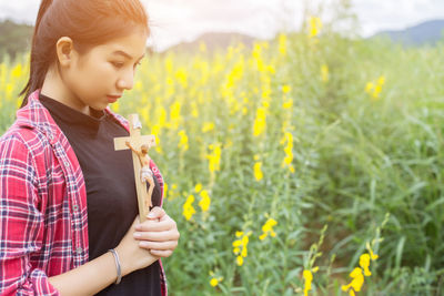 Beautiful woman standing in field