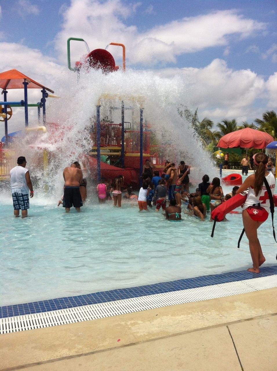 water, lifestyles, leisure activity, sky, cloud - sky, childhood, enjoyment, men, full length, person, fun, vacations, cloudy, casual clothing, boys, sitting, togetherness, motion, weekend activities