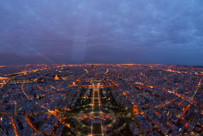 Aerial view of illuminated city at night