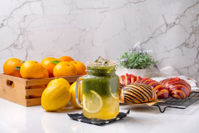 Close-up of fruits in basket on table