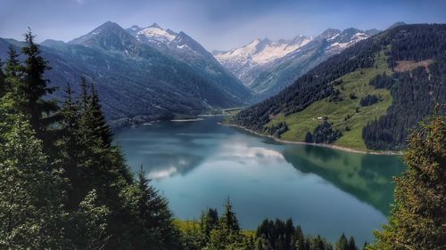 Scenic view of lake and mountains against sky