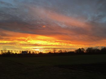 Scenic view of dramatic sky during sunset