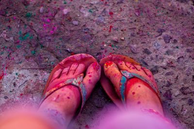 Low section of woman with powder paint during holi