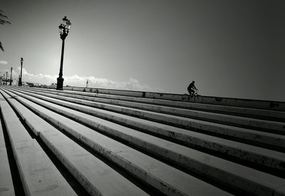 Low angle view of man walking on street