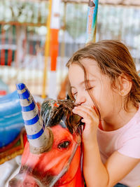 Side view of young woman looking away