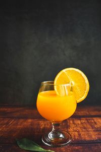 Close-up of orange juice on table