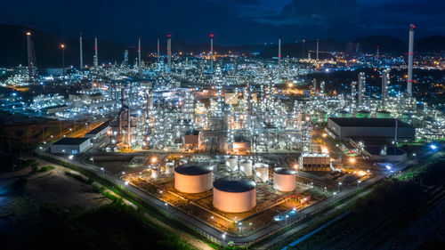 Oil and gas refinery industry for transport and export of thailand aerial view at night shot 