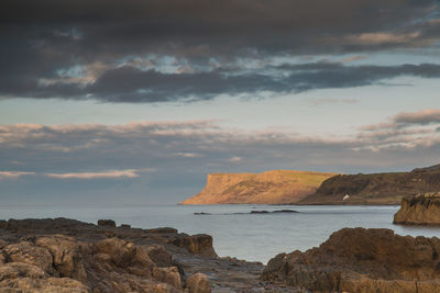 Scenic view of sea against sky at sunset