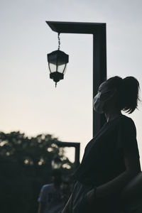 Side view point of young woman standing and relax in golden hour moment , hope and dream concept