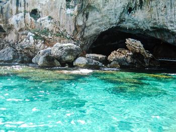 Scenic view of sea and cave